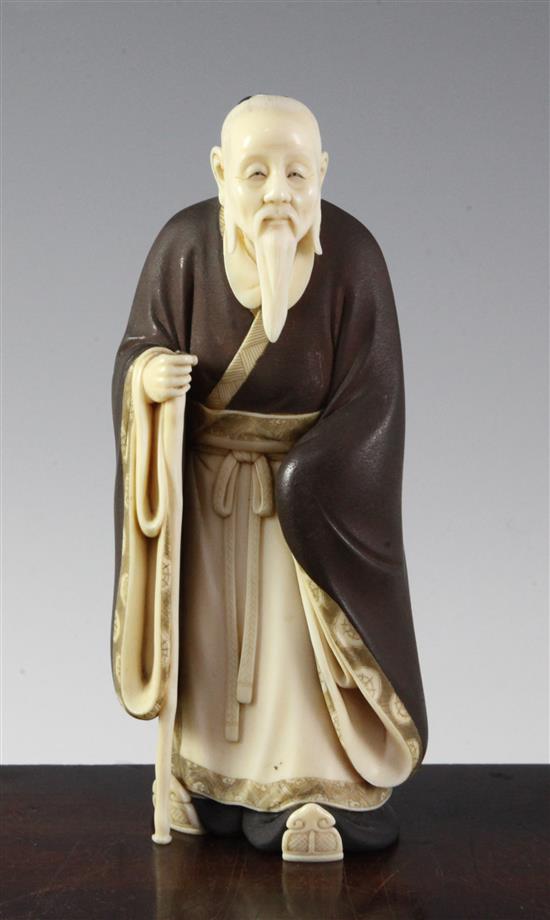 A Japanese ivory figure of a Chinese sage, Taisho period, 18.5cm, loss to staff